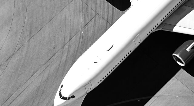 SINGLE-IMAGE_passenger-jet-runway-from-above_feb24