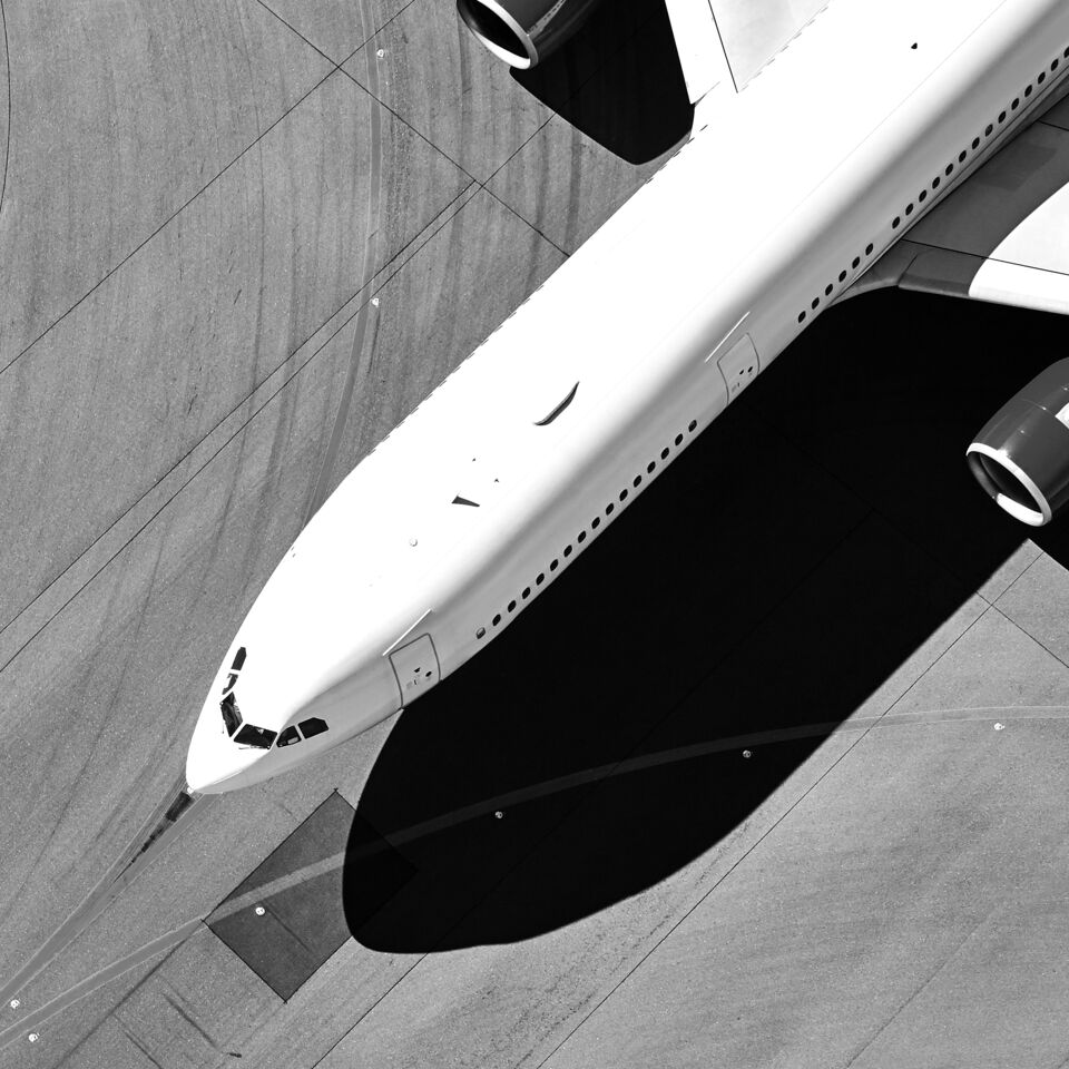 SINGLE-IMAGE_passenger-jet-runway-from-above_feb24