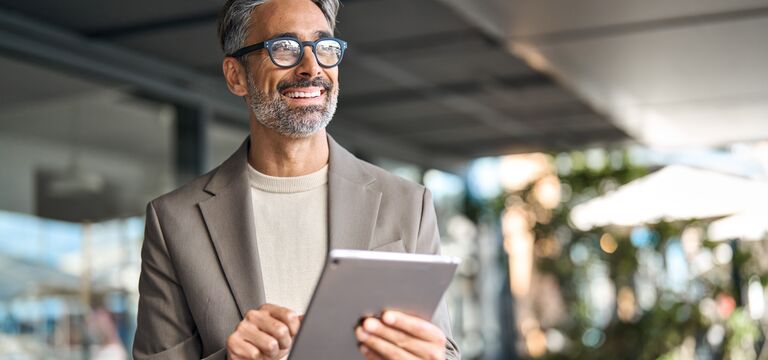 /bynder-asset/bynder:0F62803F-C87C-4C44-A1591FB20858FB7F/Landscape_MD/COLOUR+IMAGE_businessman_on_tablet_Jun26.jpg?1782345925000