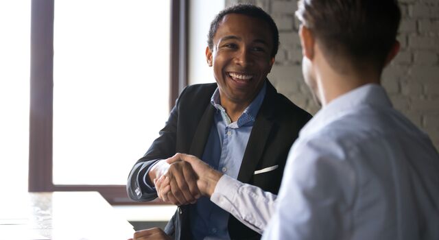 COLOUR-IMAGE_men-shaking-hands-smiling-zoomed_feb26