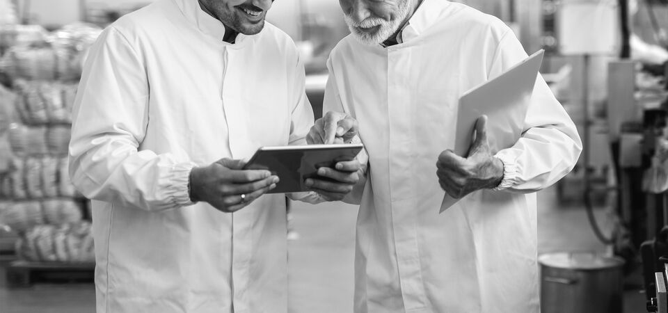 SINGLE-IMAGE_two-workers-in-food-factory-with-tablet_aug24