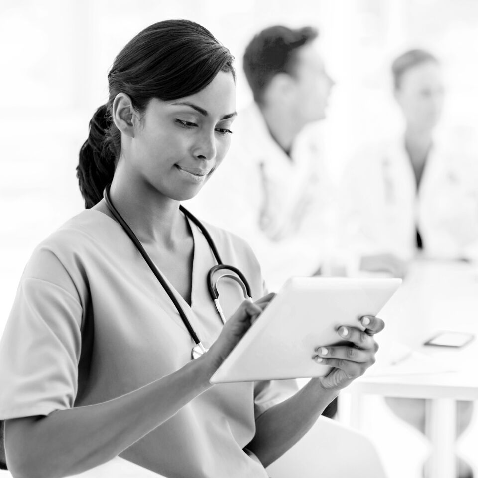 SINGLE-IMAGE_nurse-checking-tablet_aug24