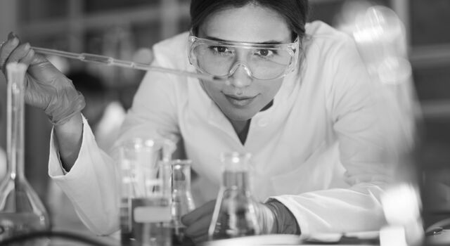 SINGLE-IMAGE_female-scientist-examining-liquid-in-laboratory_mar25