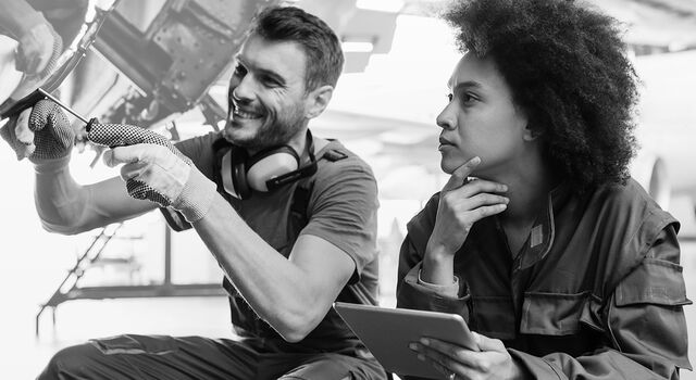 SINGLE-IMAGE_engineers-repairing aircraft-using-digital-tablet_feb25