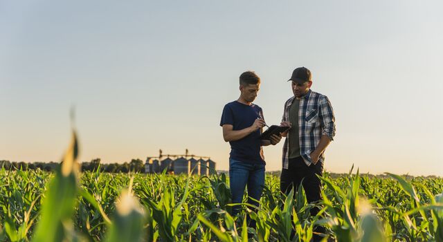 COLOUR-IMAGE_two-farmers-in-field_feb26