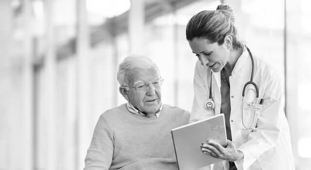 SINGLE-IMAGE_doctor-explaining-patient-on-digital-tablet_jan25