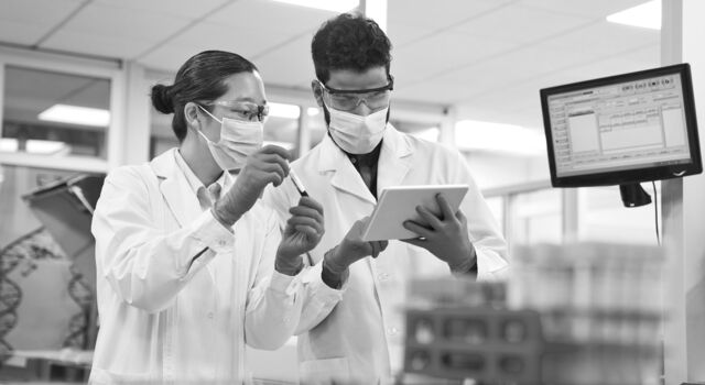 SINGLE-IMAGE_discussing-over-digital-tablet-at-laboratory_mar25