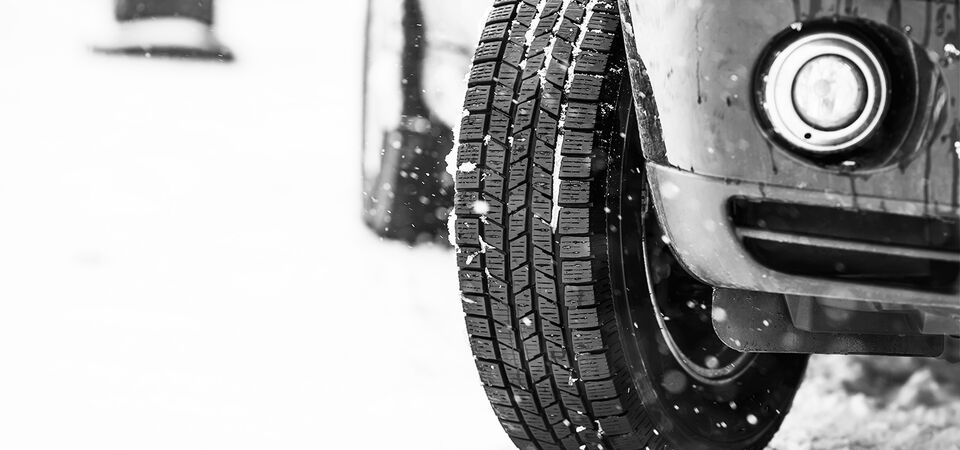 /bynder-asset/bynder:A18882D8-4B56-4AAD-A5B8FEC77C645B74/Landscape_LG/SINGLE-IMAGE_car-tires-on-winter-road_may24.jpg?1749636772000