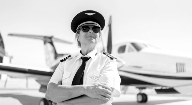 SINGLE-IMAGE_female-pilot-infront-of-plane_oct23