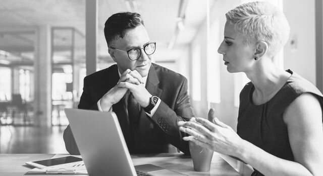 SINGLE-IMAGE_business-employees-discuss-financial-report-with-laptop_feb25