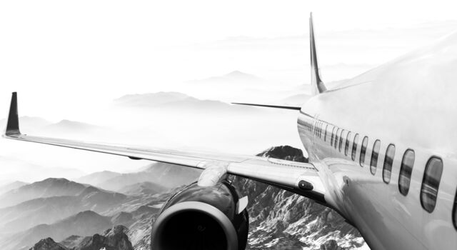 SINGLE-IMAGE_plane-in-flight-looking-back-over-wing-alt_nov23