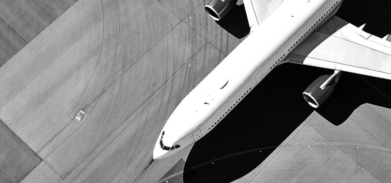 SINGLE-IMAGE_passenger-jet-runway-from-above_jul24