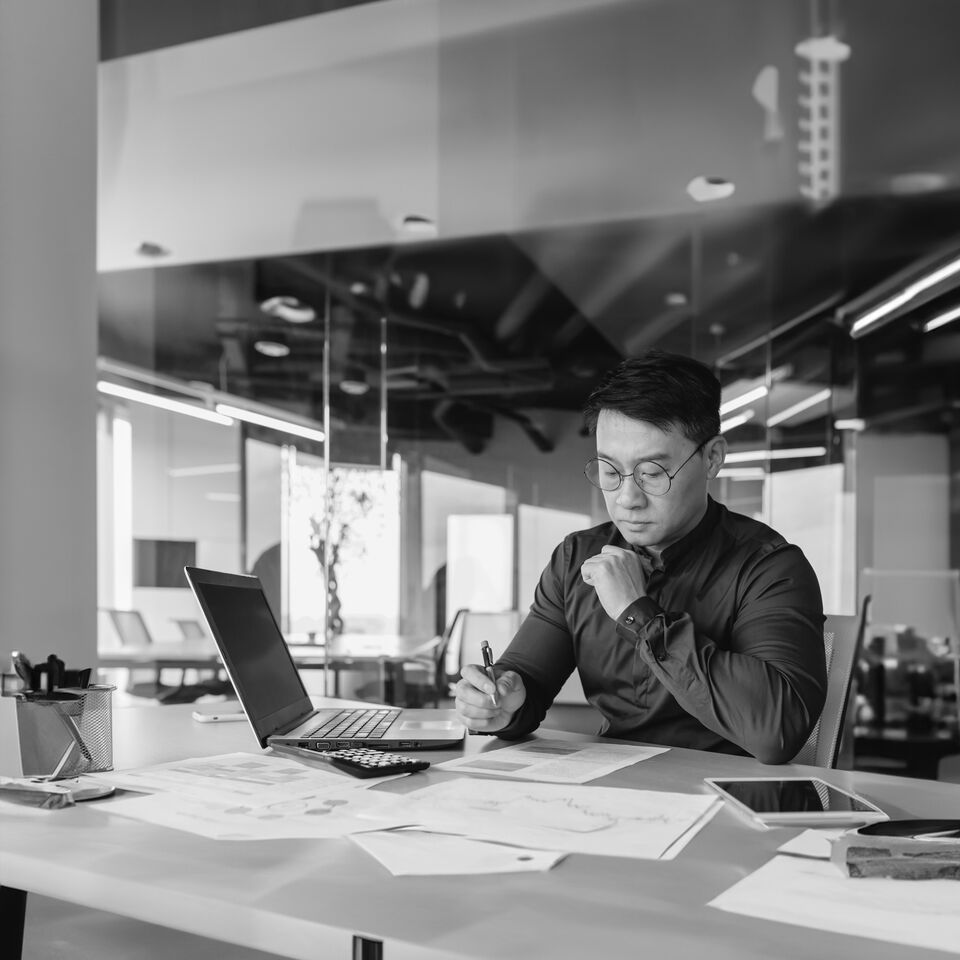 SINGLE-IMAGE_man-paperwork-black-and-white_feb24