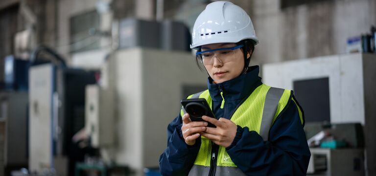 /bynder-asset/bynder:F7AB3010-98E3-4D80-963E8275F91FDF7C/Landscape_MD/COLOUR-IMAGE_female-worker-EHS-hi-vis-looking-at-mobile-phone_jul26.jpg?1784551323000